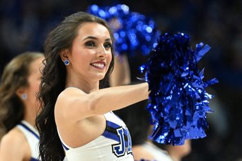 Dec 20, 2025; Omaha, Nebraska, USA;  A cheerleader for the Creighton Bluejays performs during a break in the game against the Marquette Golden Eagles during the second half at CHI Health Center Omaha. Mandatory Credit: Steven Branscombe-Imagn Images