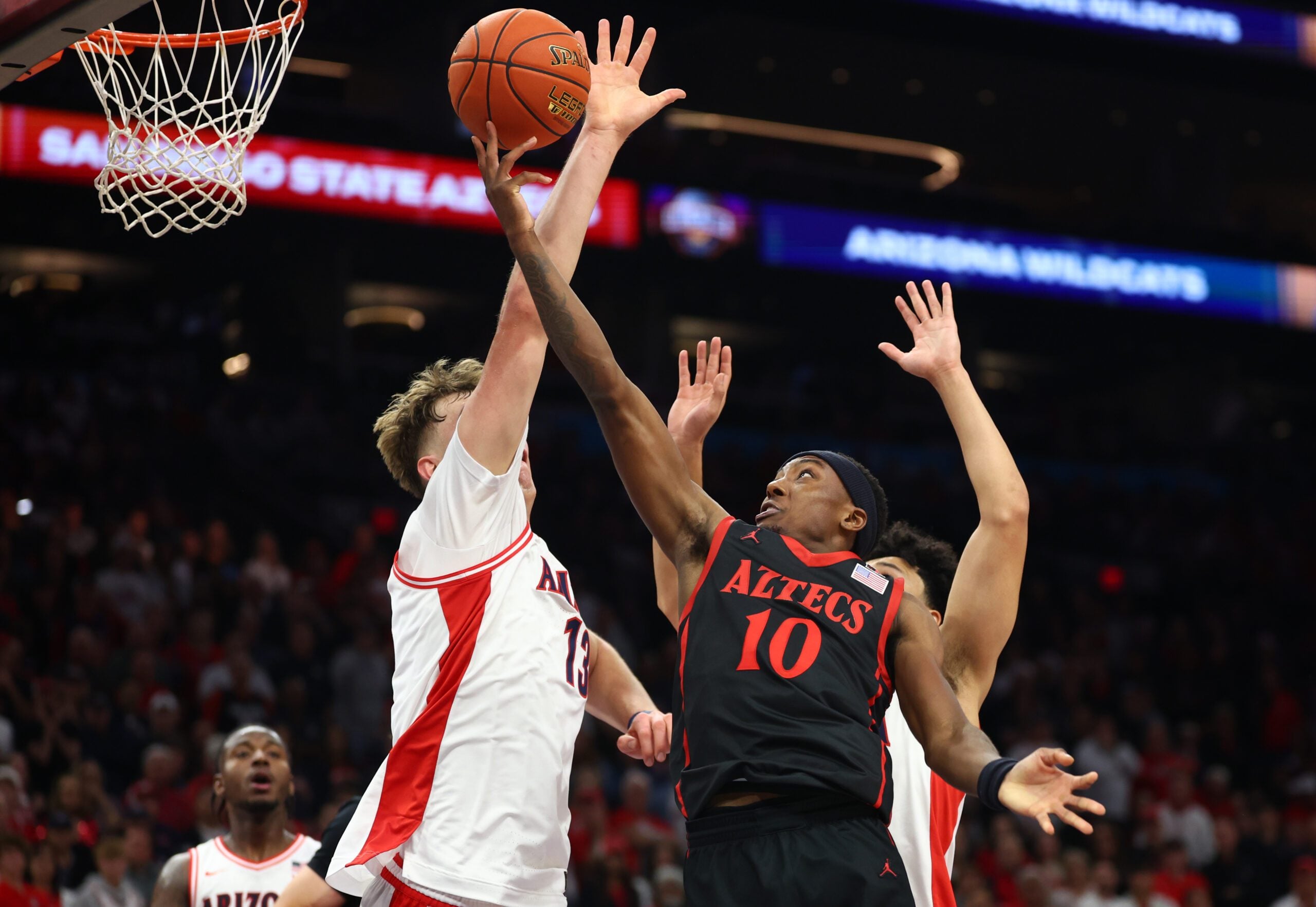 Dec 20, 2025; Phoenix, Arizona, USA; San Diego State Aztecs guard BJ Davis (10) drives to the basket against the Arizona Wildcats in the first half during the Hall of Fame Series at Mortgage Matchup Center. Mandatory Credit: Mark J. Rebilas-Imagn Images