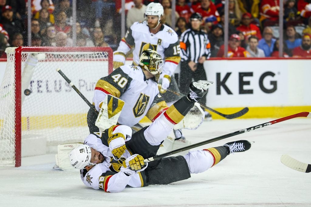 Dec 20, 2025; Calgary, Alberta, CAN; Calgary Flames left wing Joel Farabee (86) scores a goal against Vegas Golden Knights goaltender Akira Schmid (40) during the second period at Scotiabank Saddledome. Mandatory Credit: Sergei Belski-Imagn Images
