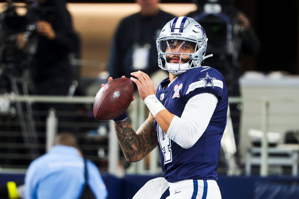 Dec 21, 2025; Arlington, Texas, USA; Dallas Cowboys quarterback Dak Prescott (4) participates in pregame warmups against the Los Angeles Chargers at AT&T Stadium. Mandatory Credit: Kevin Jairaj-Imagn Images