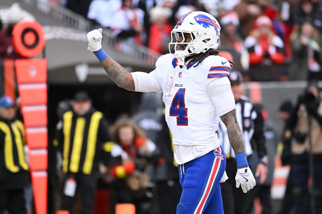 Dec 21, 2025; Cleveland, Ohio, USA; Buffalo Bills running back James Cook III (4) reacts after scoring a touchdown against the Cleveland Browns during the first half at Huntington Bank Field. Mandatory Credit: Ken Blaze-Imagn Images