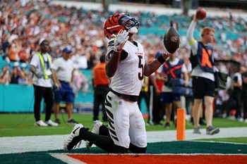 Dec 21, 2025; Miami Gardens, Florida, USA; Cincinnati Bengals wide receiver Tee Higgins (5) scores a touchdown during the second quarter against the Miami Dolphins at Hard Rock Stadium. Mandatory Credit: Nathan Ray Seebeck-Imagn Images