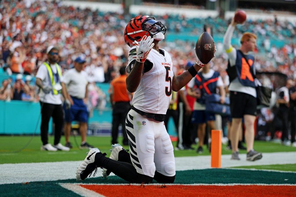 Dec 21, 2025; Miami Gardens, Florida, USA; Cincinnati Bengals wide receiver Tee Higgins (5) scores a touchdown during the second quarter against the Miami Dolphins at Hard Rock Stadium. Mandatory Credit: Nathan Ray Seebeck-Imagn Images