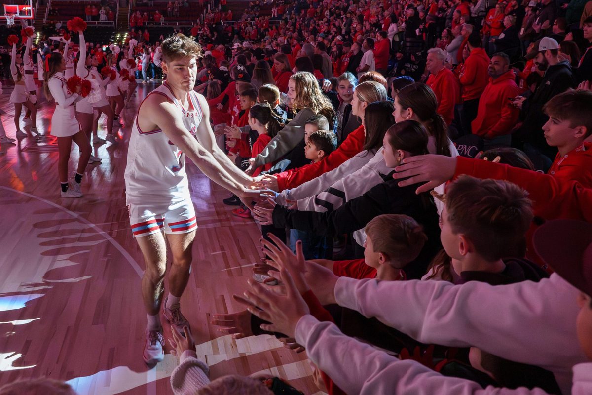 Bradley’s Alex Huibregtse takes the spotlight during player introductions before the start of the Braves’ Missouri Valley Conference college basketball home opener against SIU on Sunday, Dec. 21, 2025 at Carver Arena in Peoria. The Braves defeated the Salukis 73-69.