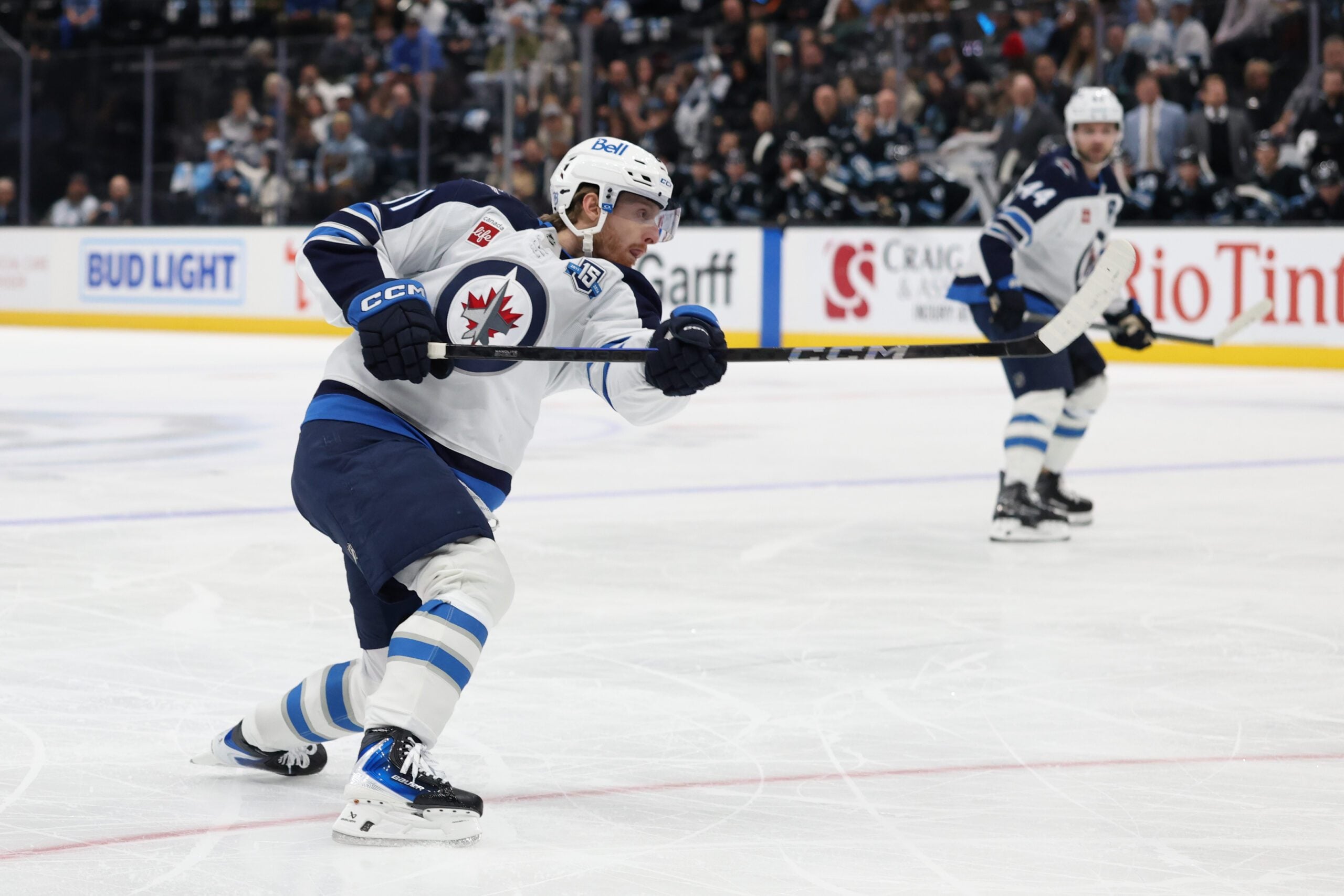 Dec 21, 2025; Salt Lake City, Utah, USA; Winnipeg Jets left wing Kyle Connor (81) holds the follow through on a shot that scores a goal against the Utah Mammoth during the second period at Delta Center. Mandatory Credit: Rob Gray-Imagn Images