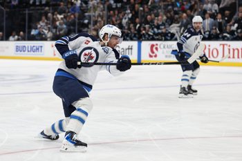 Dec 21, 2025; Salt Lake City, Utah, USA; Winnipeg Jets left wing Kyle Connor (81) holds the follow through on a shot that scores a goal against the Utah Mammoth during the second period at Delta Center. Mandatory Credit: Rob Gray-Imagn Images