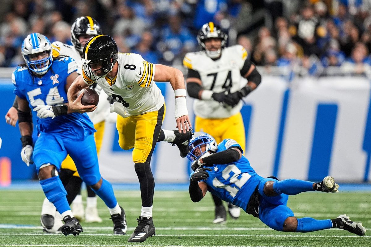 Pittsburgh Steelers quarterback Aaron Rodgers (8) runs against Detroit Lions safety Thomas Harper (12) during the second half at Ford Field in Detroit on Sunday, Dec. 21, 2025.