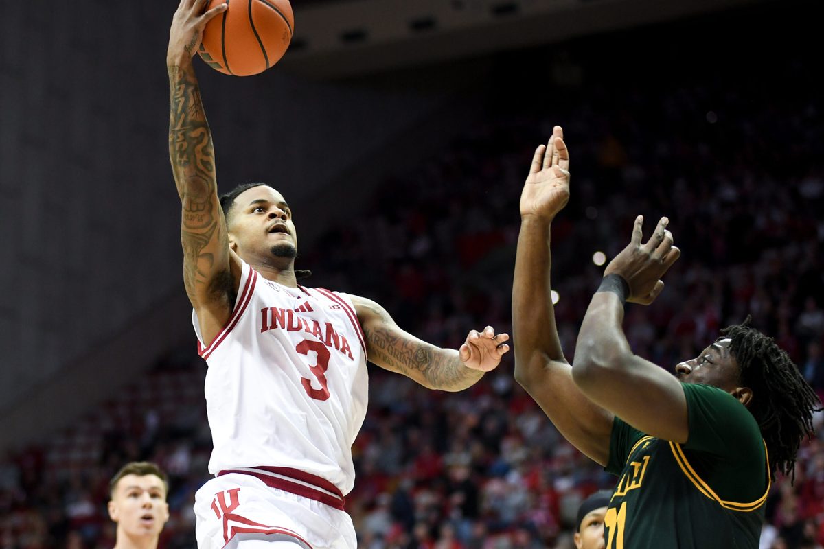 Dec 22, 2025; Bloomington, Indiana, USA; Indiana Hoosiers guard Lamar Wilkerson (3) scores past Siena Saints forward Francis Folefac (11) during the first half at Simon Skjodt Assembly Hall. Mandatory Credit: Robert Goddin-Imagn Images