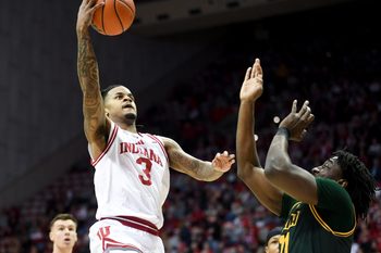 Dec 22, 2025; Bloomington, Indiana, USA; Indiana Hoosiers guard Lamar Wilkerson (3) scores past Siena Saints forward Francis Folefac (11) during the first half at Simon Skjodt Assembly Hall. Mandatory Credit: Robert Goddin-Imagn Images