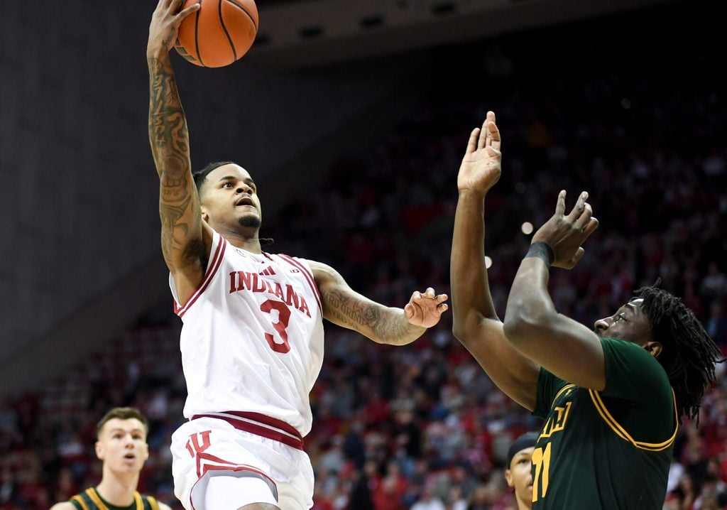 Dec 22, 2025; Bloomington, Indiana, USA; Indiana Hoosiers guard Lamar Wilkerson (3) scores past Siena Saints forward Francis Folefac (11) during the first half at Simon Skjodt Assembly Hall. Mandatory Credit: Robert Goddin-Imagn Images
