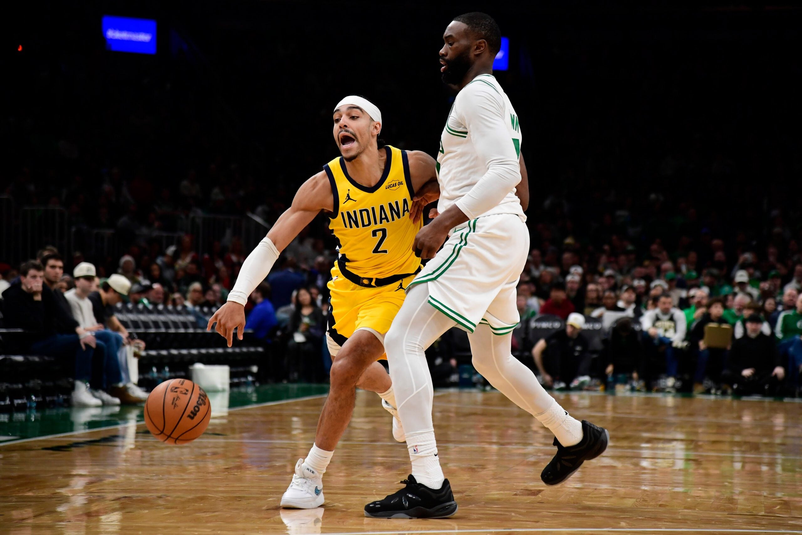 Dec 22, 2025; Boston, Massachusetts, USA; Boston Celtics guard Jaylen Brown (7) defends Indiana Pacers guard Andrew Nembhard (2) during the second half at TD Garden. Mandatory Credit: Bob DeChiara-Imagn Images