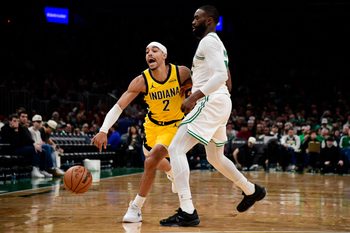Dec 22, 2025; Boston, Massachusetts, USA; Boston Celtics guard Jaylen Brown (7) defends Indiana Pacers guard Andrew Nembhard (2) during the second half at TD Garden. Mandatory Credit: Bob DeChiara-Imagn Images