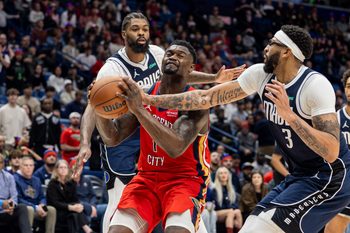 Dec 22, 2025; New Orleans, Louisiana, USA;  New Orleans Pelicans forward Zion Williamson (1) is fouled by Dallas Mavericks forward/center Anthony Davis (3) as he goes to the basket during the second half at Smoothie King Center. Mandatory Credit: Stephen Lew-Imagn Images