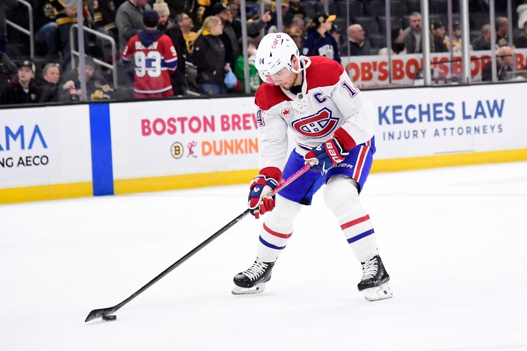 Dec 23, 2025; Boston, Massachusetts, USA; Montréal Canadiens center Nick Suzuki (14) stickhandles with the puck prior to a game against the Boston Bruins at TD Garden. Mandatory Credit: Bob DeChiara-Imagn Images