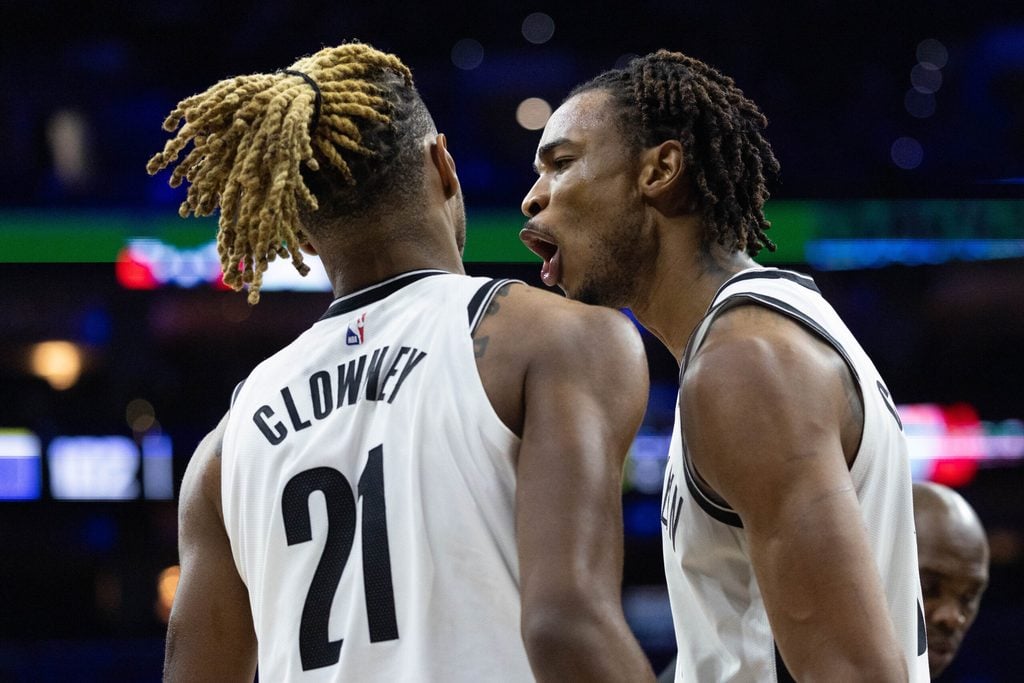 Dec 23, 2025; Philadelphia, Pennsylvania, USA; Brooklyn Nets center Nic Claxton (33) reacts with forward Noah Clowney (21) after a defensive stop against the Philadelphia 76ers during the fourth quarter at Xfinity Mobile Arena. Mandatory Credit: Bill Streicher-Imagn Images