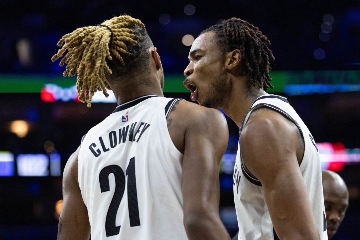 Dec 23, 2025; Philadelphia, Pennsylvania, USA; Brooklyn Nets center Nic Claxton (33) reacts with forward Noah Clowney (21) after a defensive stop against the Philadelphia 76ers during the fourth quarter at Xfinity Mobile Arena. Mandatory Credit: Bill Streicher-Imagn Images