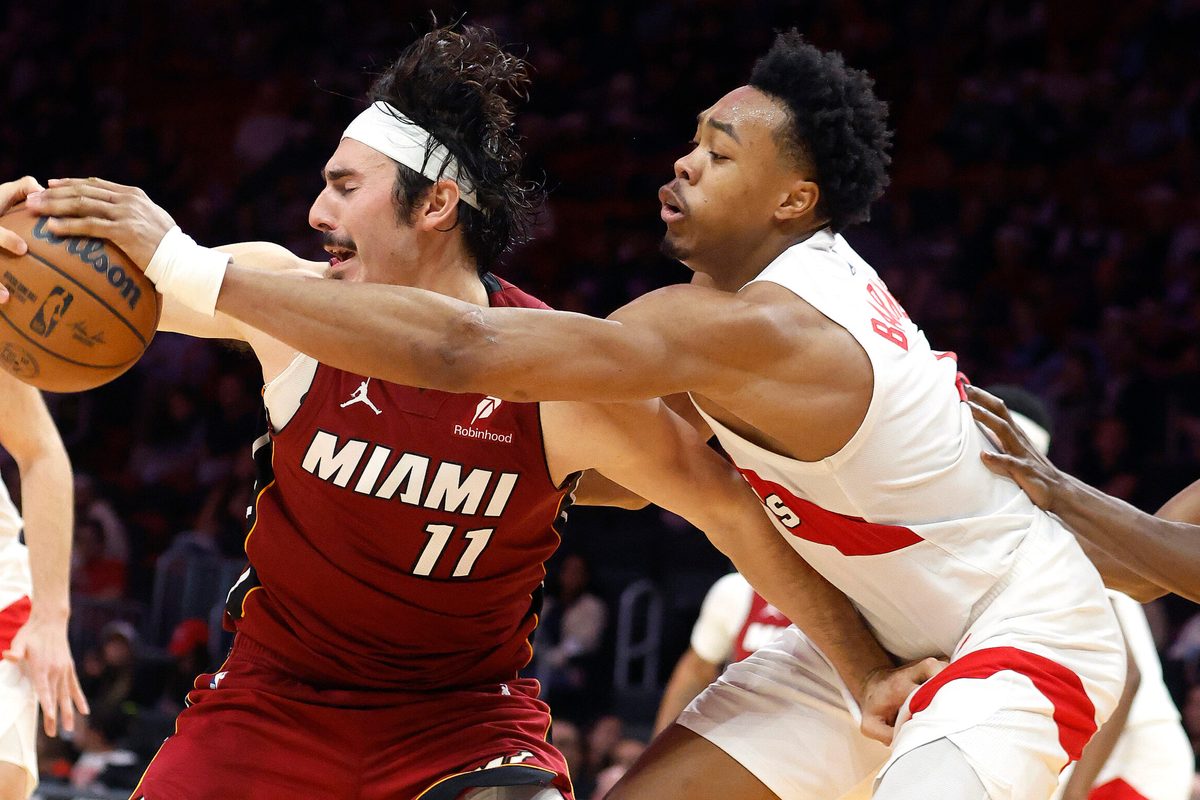 Dec 23, 2025; Miami, Florida, USA;  Toronto Raptors forward Scottie Barnes (4) knocks the ball away from Miami Heat forward Jaime Jaquez Jr. (11) during the second half at Kaseya Center. Mandatory Credit: Rhona Wise-Imagn Images