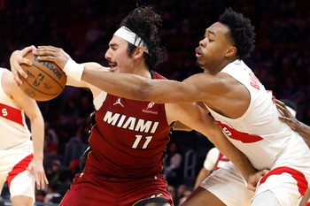Dec 23, 2025; Miami, Florida, USA;  Toronto Raptors forward Scottie Barnes (4) knocks the ball away from Miami Heat forward Jaime Jaquez Jr. (11) during the second half at Kaseya Center. Mandatory Credit: Rhona Wise-Imagn Images