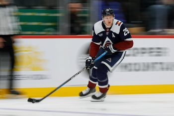 Dec 23, 2025; Denver, Colorado, USA; Colorado Avalanche center Nathan MacKinnon (29) controls the puck in the second period against the Utah Mammoth at Ball Arena. Mandatory Credit: Isaiah J. Downing-Imagn Images