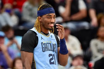 Dec 23, 2025; Salt Lake City, Utah, USA; Memphis Grizzlies guard Jahmai Mashack (21) reacts to a play during the second half against the Utah Jazz at Delta Center. Mandatory Credit: Peter Creveling-Imagn Images