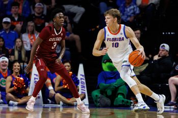 Dec 21, 2025; Gainesville, Florida, USA; Florida Gators forward Thomas Haugh (10) dribbles the ball while Colgate Raiders guard Jalen Cox (3) defends during the first half at Exactech Arena at the Stephen C. O'Connell Center. Mandatory Credit: Matt Pendleton-Imagn Images