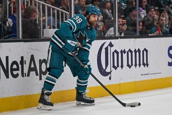 Dec 20, 2025; San Jose, California, USA; San Jose Sharks defenseman Mario Ferraro (38) controls the puck against the Seattle Kraken during the first period at SAP Center at San Jose. Mandatory Credit: Justine Willard-Imagn Images