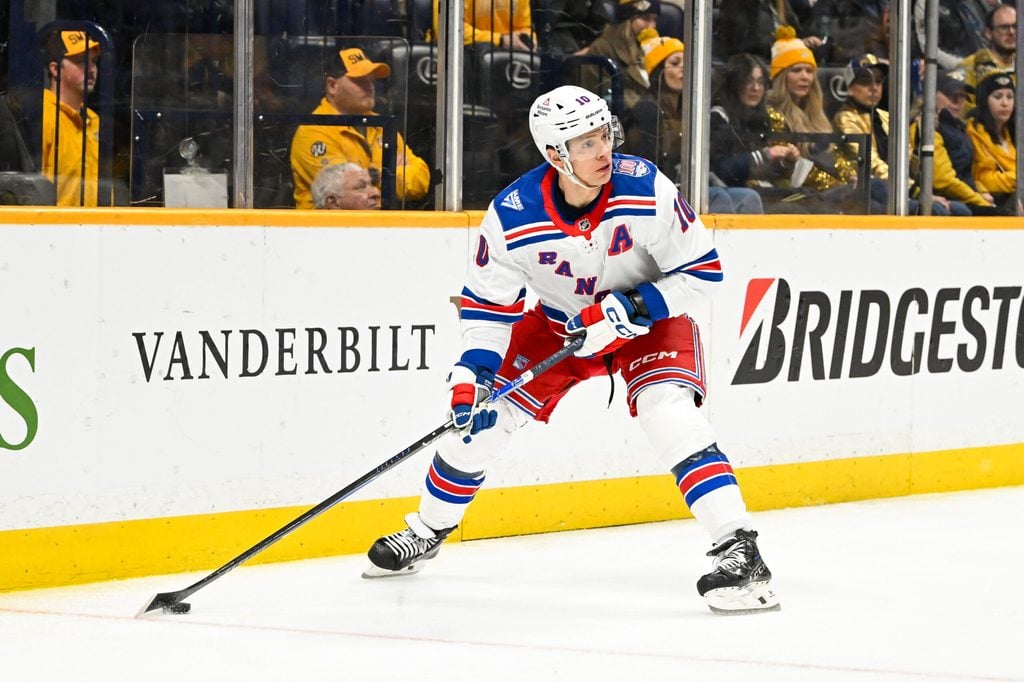 Dec 21, 2025; Nashville, Tennessee, USA; New York Rangers left wing Artemi Panarin (10) skates behind the net against the Nashville Predators during the second period at Bridgestone Arena. Mandatory Credit: Steve Roberts-Imagn Images