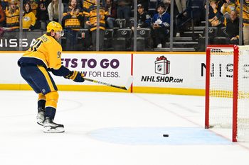 Dec 20, 2025; Nashville, Tennessee, USA;  Nashville Predators center Steven Stamkos (91) scores an empty net goal against the Toronto Maple Leafs during the third period at Bridgestone Arena. Mandatory Credit: Steve Roberts-Imagn Images