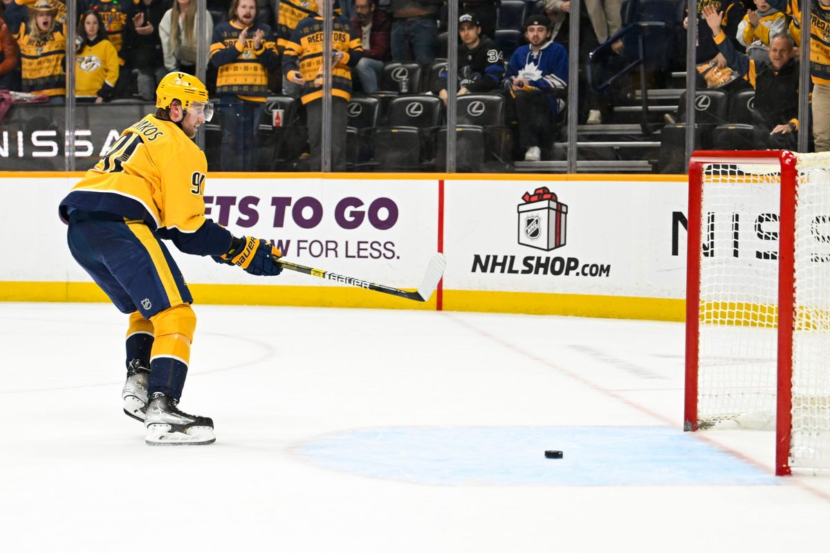 Dec 20, 2025; Nashville, Tennessee, USA; Nashville Predators center Steven Stamkos (91) scores an empty net goal against the Toronto Maple Leafs during the third period at Bridgestone Arena. Mandatory Credit: Steve Roberts-Imagn Images