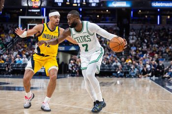 Dec 26, 2025; Indianapolis, Indiana, USA; Boston Celtics guard/forward Jaylen Brown (7) dribbles the ball while  Indiana Pacers guard/forward Andrew Nembhard (2) defends in the second half at Gainbridge Fieldhouse. Mandatory Credit: Trevor Ruszkowski-Imagn Images