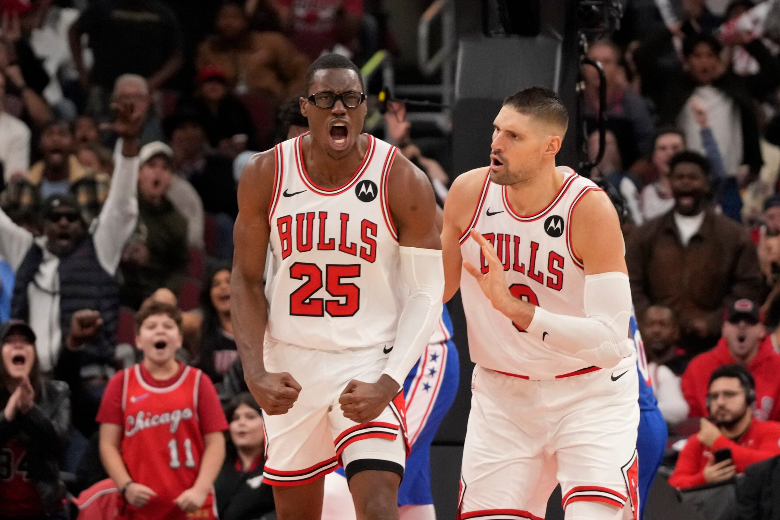 Dec 26, 2025; Chicago, Illinois, USA; Chicago Bulls forward Jalen Smith (25) gestures after dunking the ball against the Philadelphia 76ers as center Nikola Vucevic (9) stands nearby during the second half at United Center. Mandatory Credit: David Banks-Imagn Images