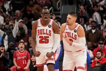 Dec 26, 2025; Chicago, Illinois, USA; Chicago Bulls forward Jalen Smith (25) gestures after dunking the ball against the Philadelphia 76ers as center Nikola Vucevic (9) stands nearby during the second half at United Center. Mandatory Credit: David Banks-Imagn Images