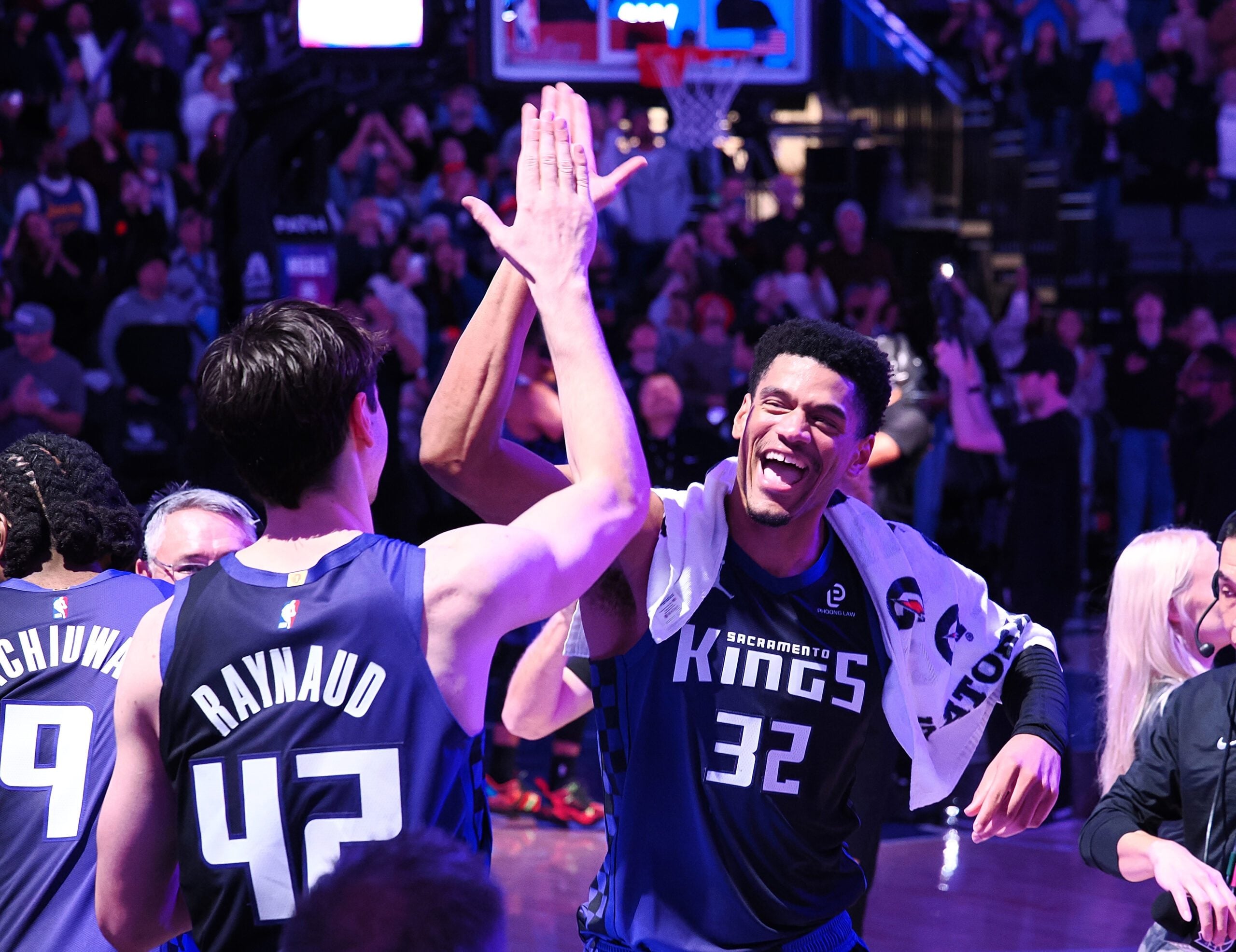 Dec 27, 2025; Sacramento, California, USA; Sacramento Kings center Maxime Raynaud (42) and center Dylan Cardwell (32) celebrate after the game against the Dallas Mavericks at Golden 1 Center. Mandatory Credit: Kelley L Cox-Imagn Images