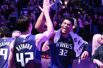 Dec 27, 2025; Sacramento, California, USA; Sacramento Kings center Maxime Raynaud (42) and center Dylan Cardwell (32) celebrate after the game against the Dallas Mavericks at Golden 1 Center. Mandatory Credit: Kelley L Cox-Imagn Images