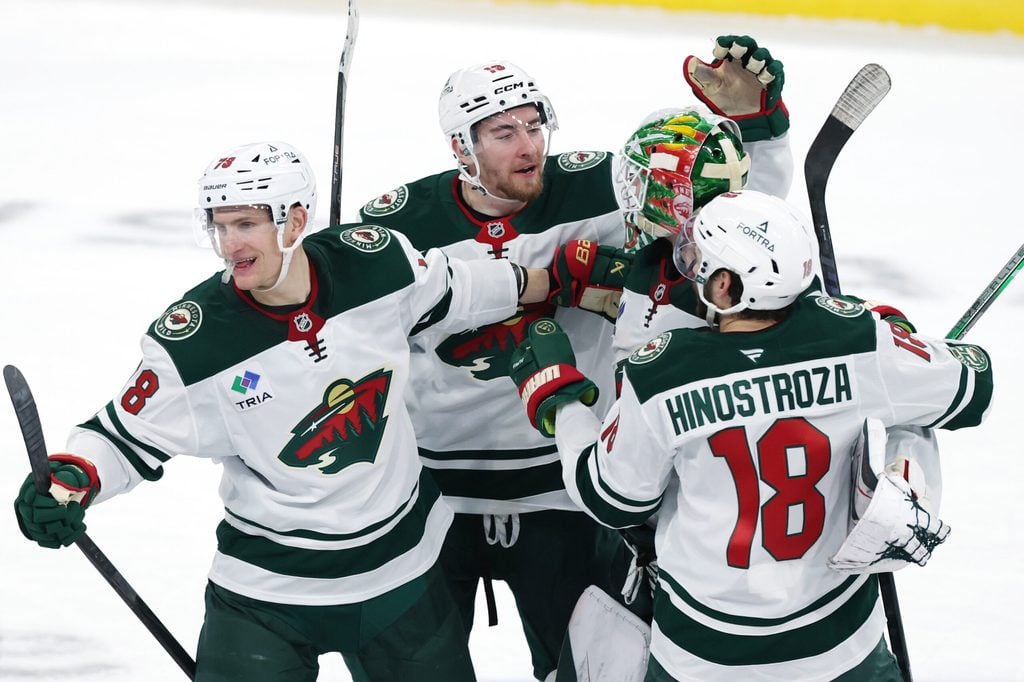 Dec 27, 2025; Winnipeg, Manitoba, CAN; mw players celebrate their overtime win against the Winnipeg Jets at Canada Life Centre. Mandatory Credit: James Carey Lauder-Imagn Images