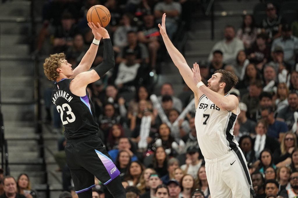 Dec 27, 2025; San Antonio, Texas, USA; Utah Jazz forward Lauri Markkanen (23) shoots over San Antonio Spurs center Luke Kornet (7) during the second half at Frost Bank Center. Mandatory Credit: Scott Wachter-Imagn Images