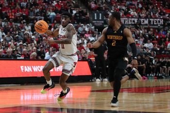 Dec 28, 2025; Lubbock, Texas, USA; Texas Tech Red Raiders guard Jaylen Petty (11) races down court against Winthrop Eagles guard Kareem Rozier (2) in the second half at United Supermarkets Arena. Mandatory Credit: Michael C. Johnson-Imagn Images