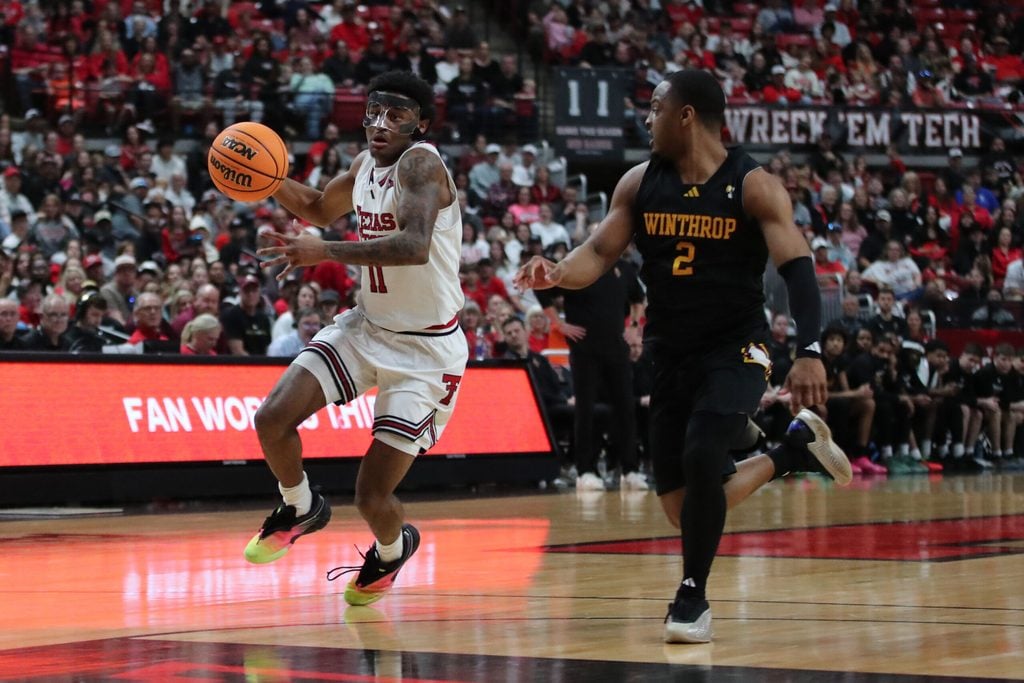 Dec 28, 2025; Lubbock, Texas, USA; Texas Tech Red Raiders guard Jaylen Petty (11) races down court against Winthrop Eagles guard Kareem Rozier (2) in the second half at United Supermarkets Arena. Mandatory Credit: Michael C. Johnson-Imagn Images