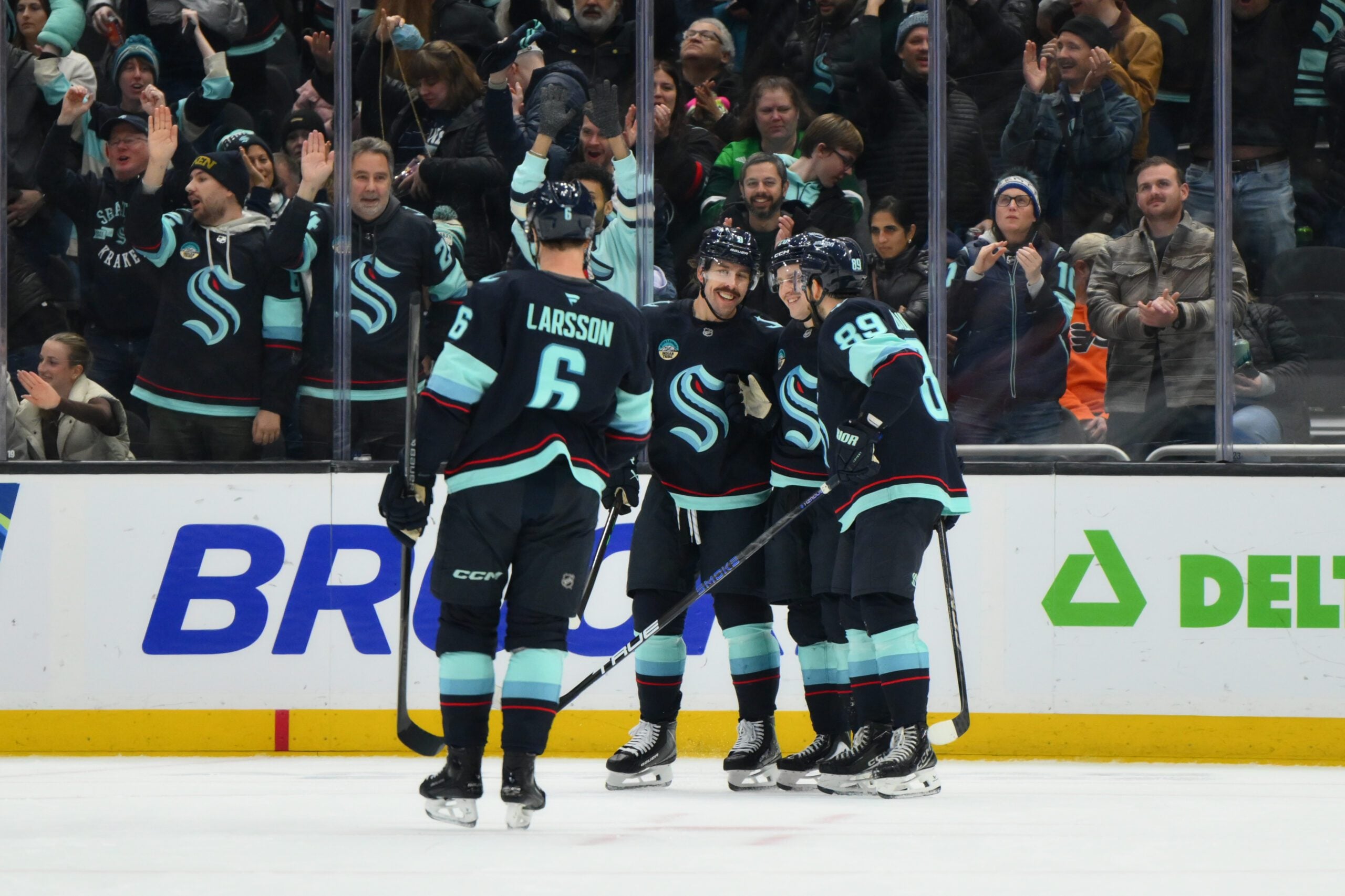 Dec 28, 2025; Seattle, Washington, USA; The Seattle Kraken celebrate after an empty net goal scored by right wing Eeli Tolvanen (20) against the Philadelphia Flyers during the third period at Climate Pledge Arena. Mandatory Credit: Steven Bisig-Imagn Images