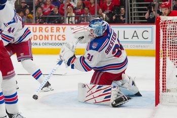 Dec 29, 2025; Raleigh, North Carolina, USA;  New York Rangers goaltender Igor Shesterkin (31) clears the puck away against the Carolina Hurricanes during the third period at Lenovo Center. Mandatory Credit: James Guillory-Imagn Images