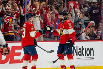Dec 29, 2025; Sunrise, Florida, USA; Florida Panthers defenseman Aaron Ekblad (5) and center Sam Reinhart (13) celebrate his goal against the Washington Capitals during the third period at Amerant Bank Arena. Mandatory Credit: Jeff Romance-Imagn Images
