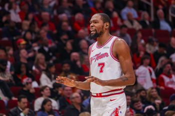 Dec 29, 2025; Houston, Texas, USA; Houston Rockets forward Kevin Durant (7) talks to a fan during a break against the Indiana Pacers in the third quarter at Toyota Center. Mandatory Credit: Thomas Shea-Imagn Images