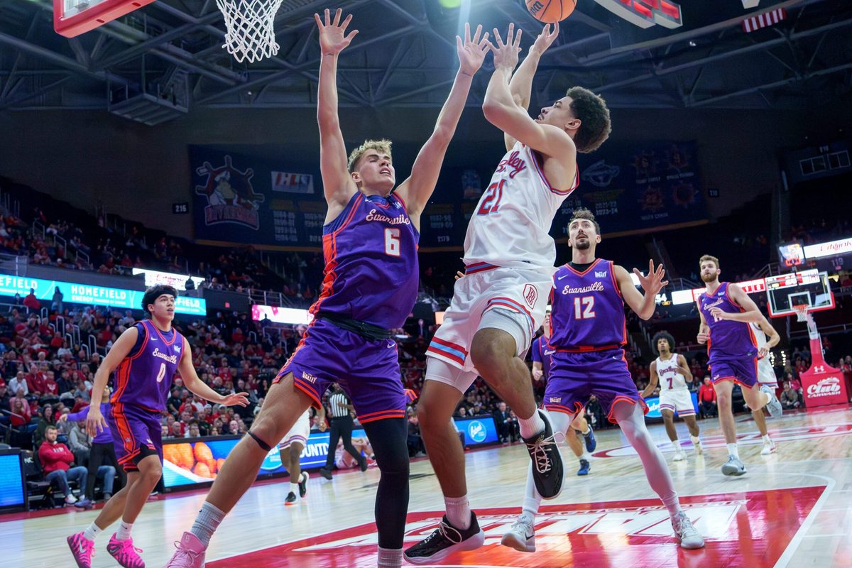 Bradley's AJ Smith puts up a shot over Evansville's Leif Moeller in the first half of their MVC college basketball game Monday, Dec. 29, 2025 at Carver Arena in Peoria. The Braves defeated the Aces 76-68.
