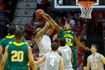 Mar 20, 2011; Cleveland, OH, USA; George Mason Patriots guard Rashad Whack (23) fouls Ohio State Buckeyes forward Dallas Lauderdale (52) as he shoots during the third round of the 2011 NCAA men's basketball tournament at Quicken Loans Arena. Mandatory Credit: Rick Osentoski-Imagn Images