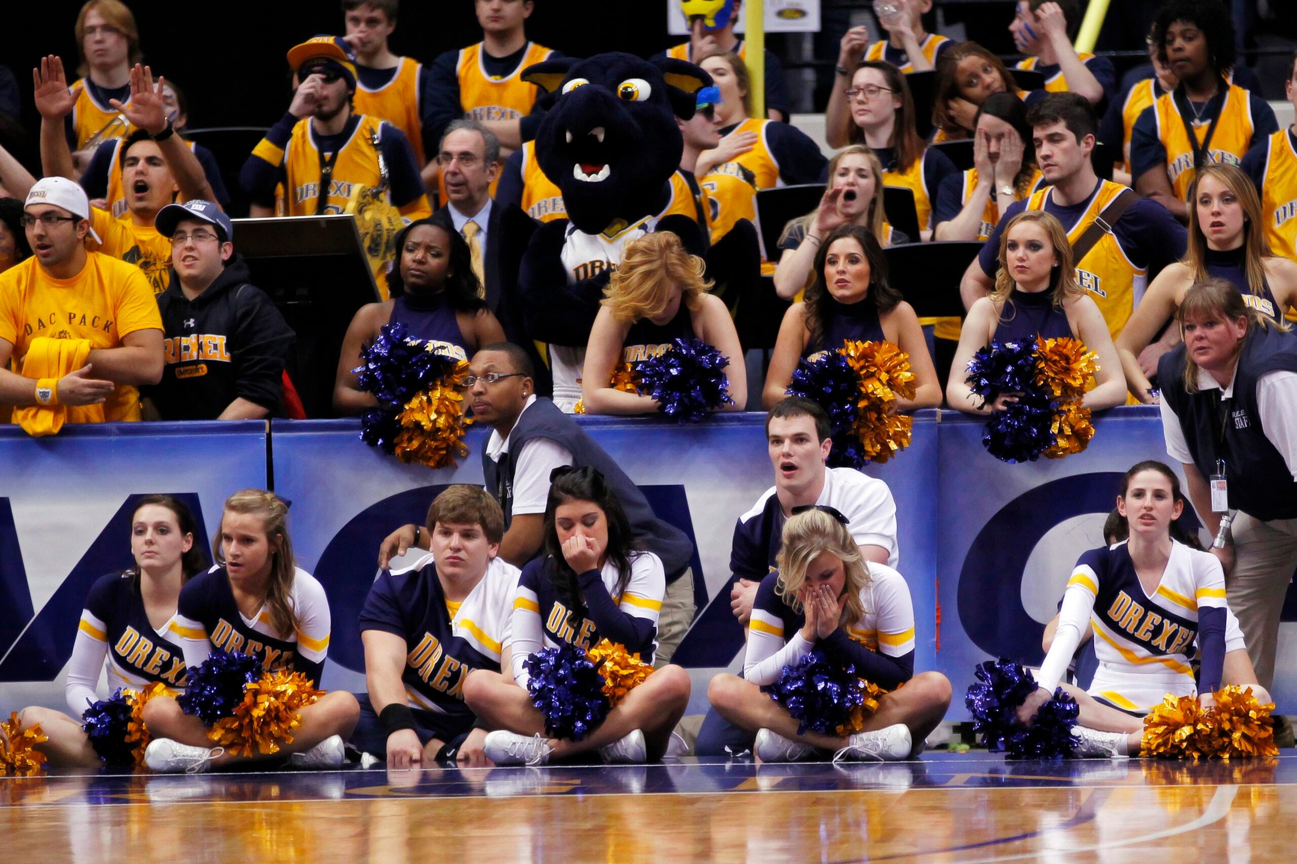 March 5, 2012; Richmond, VA USA; Drexel Dragons cheerleaders watch form the stands against the Virginia Commonwealth Rams in the closing seconds of the second half of the championship game of the 2012 Colonial Athletic Association Tournament at the Richmond Coliseum. The Rams won 59-56. Mandatory Credit: Geoff Burke-Imagn Images