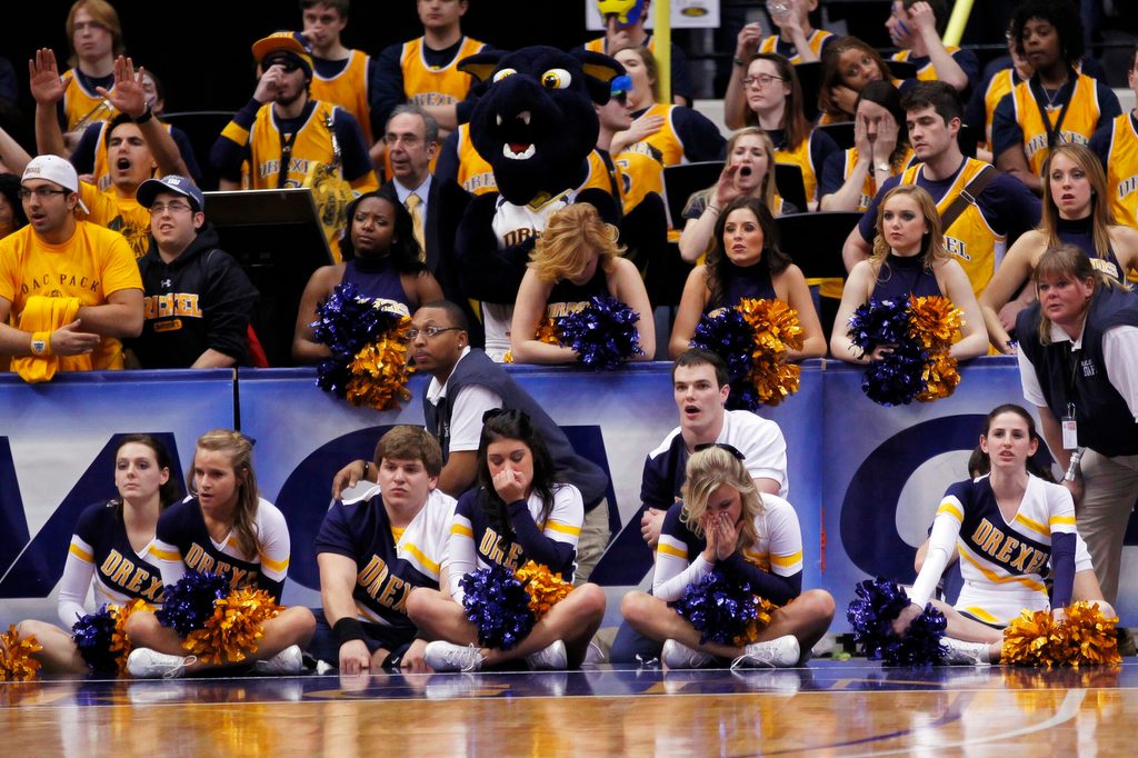 March 5, 2012; Richmond, VA USA; Drexel Dragons cheerleaders watch form the stands against the Virginia Commonwealth Rams in the closing seconds of the second half of the championship game of the 2012 Colonial Athletic Association Tournament at the Richmond Coliseum. The Rams won 59-56. Mandatory Credit: Geoff Burke-Imagn Images