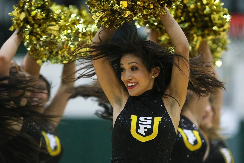 Dec 4, 2012; San Francisco, CA, USA; San Francisco Dons cheerleader performs against the St. John's Red Storm during the second half at Memorial Gymnasium. The San Francisco Dons defeated the St. John's Red Storm 81-65. Mandatory Credit: Kelley L Cox-Imagn Images