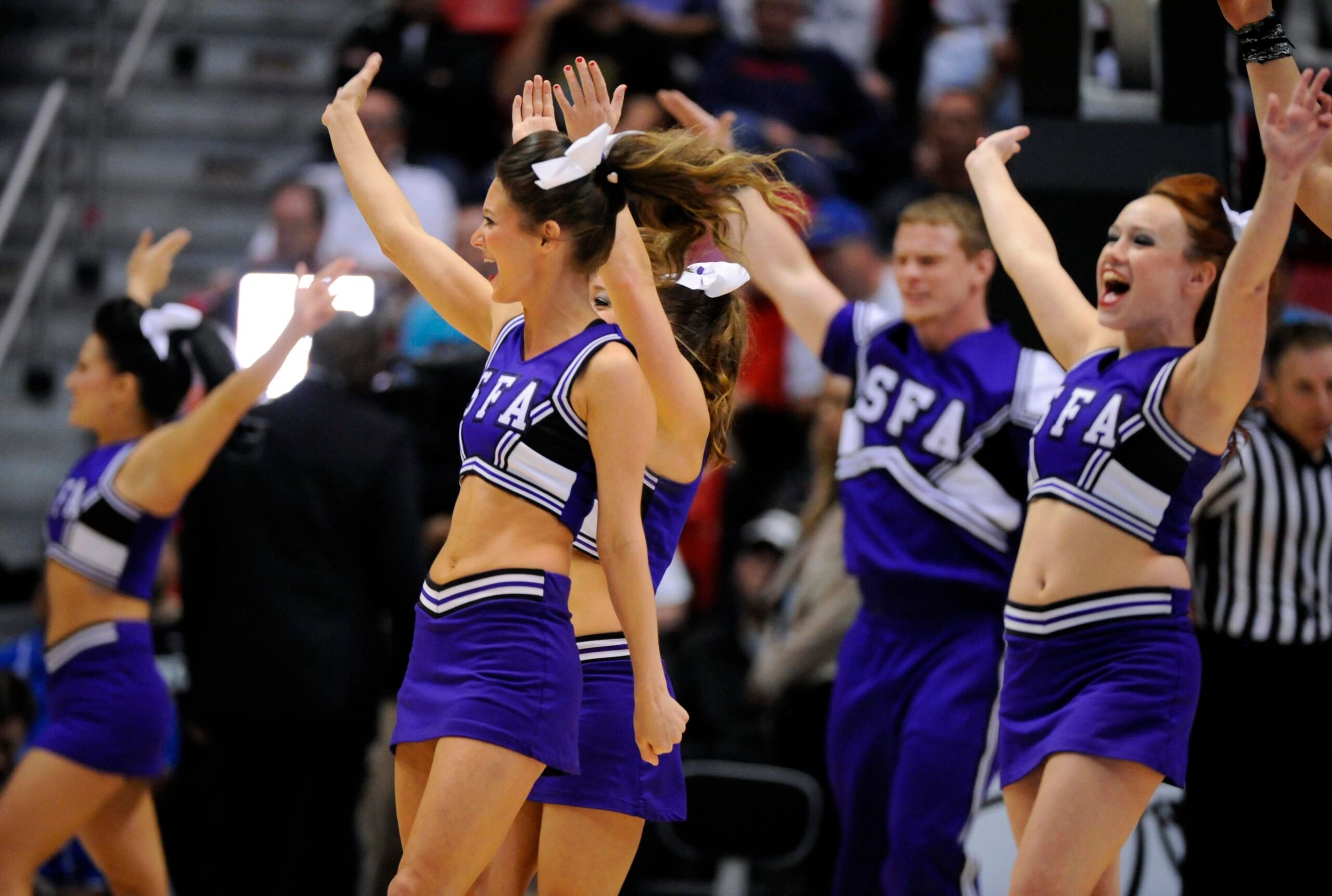 Mar 23, 2014; San Diego, CA, USA; Stephen F. Austin Lumberjacks cheerleaders perform in the first half of a men's college basketball game during the third round of the 2014 NCAA Tournament against the UCLA Bruins at Viejas Arena. Mandatory Credit: Christopher Hanewinckel-Imagn Images
