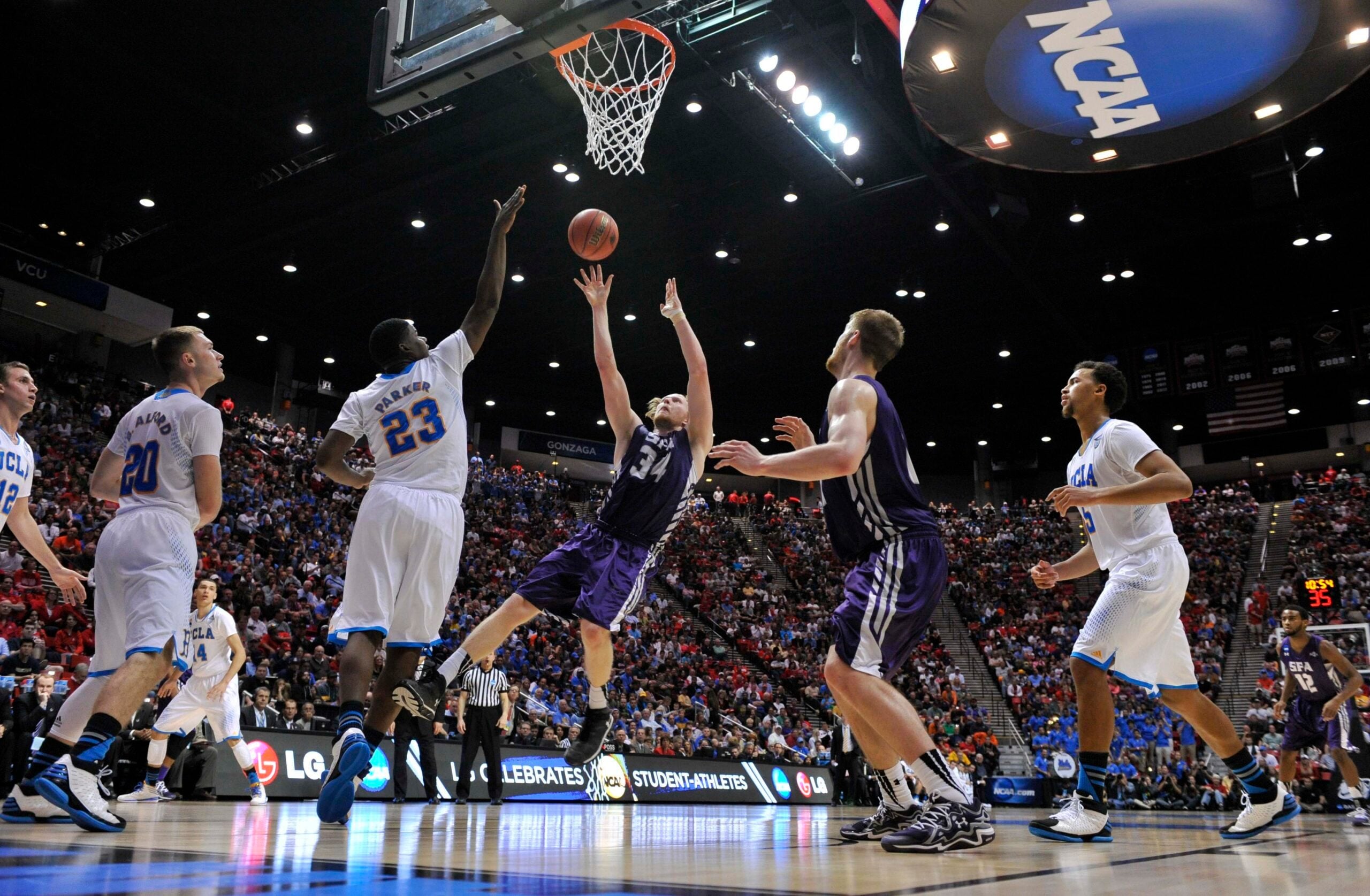 Mar 23, 2014; San Diego, CA, USA; Stephen F. Austin Lumberjacks forward Jacob Parker (34) shoots against the UCLA Bruins in the second half of a men's college basketball game during the third round of the 2014 NCAA Tournament at Viejas Arena. Mandatory Credit: Robert Hanashiro-Imagn Images