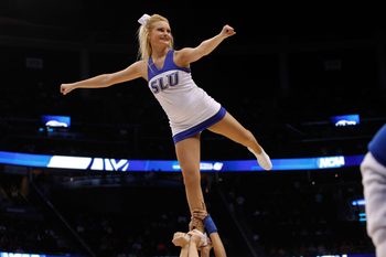 Mar 22, 2014; Orlando, FL, USA; Saint Louis Billikens cheerleader cheers against the Louisville Cardinals in the first half of a men's college basketball game during the third round of the 2014 NCAA Tournament at Amway Center. Mandatory Credit: Kim Klement-Imagn Images